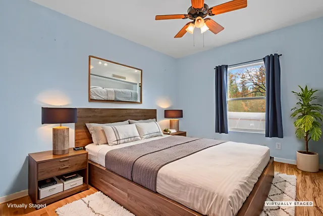 a bedroom with bed and window