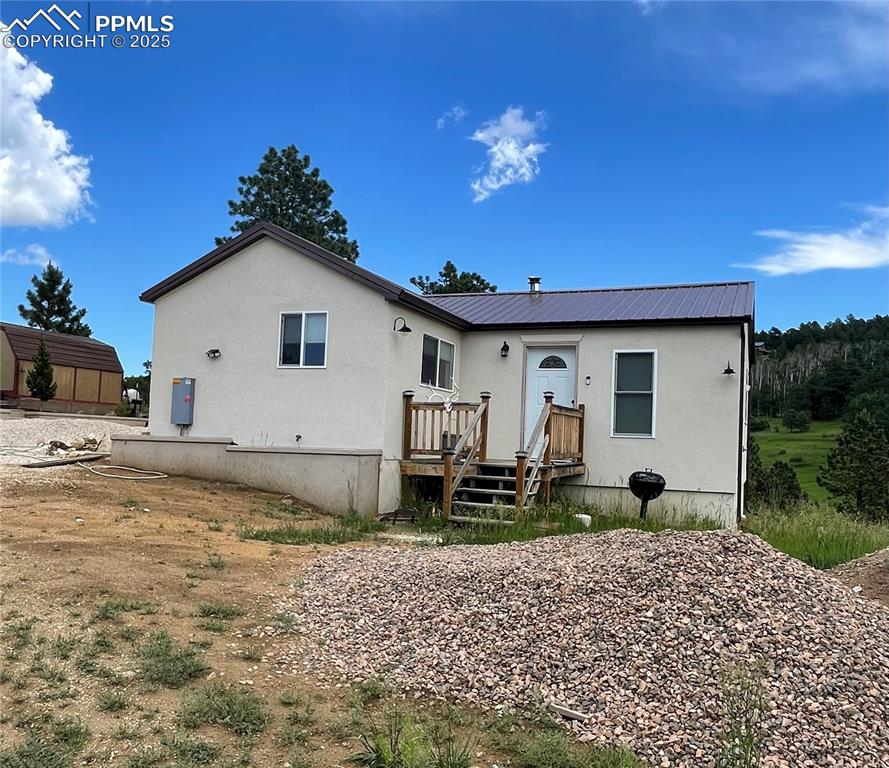 291 Junkins Loop Westcliffe, CO 81252 - Photo 26 of 41 a front view of a house with garden