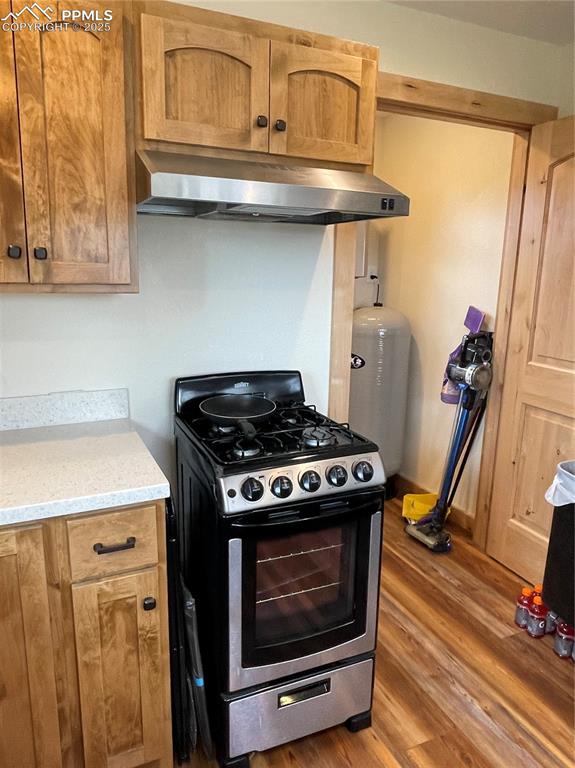 291 Junkins Loop Westcliffe, CO 81252 - Photo 9 of 41 a stove top oven sitting inside of a kitchen