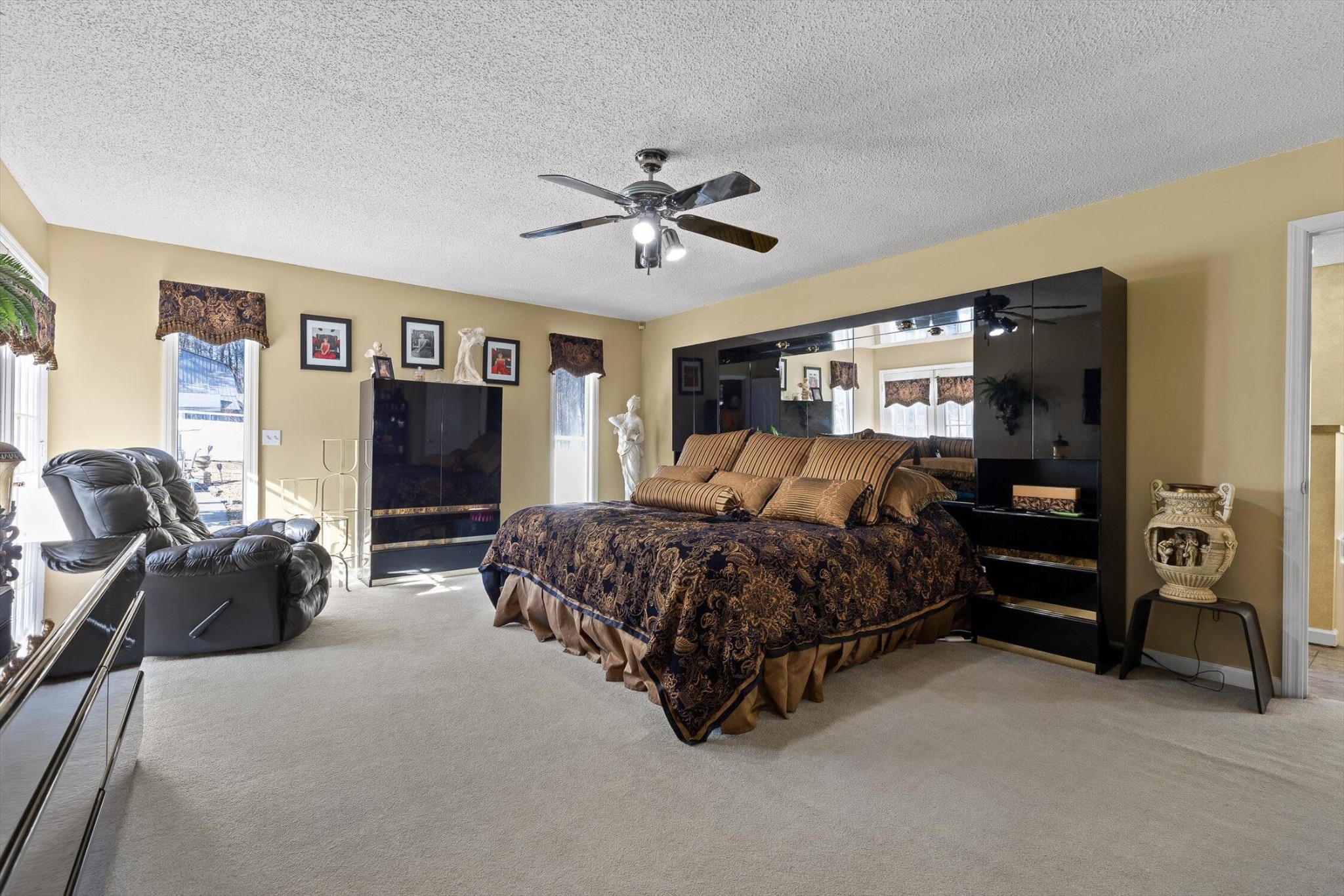 5017 McDonald Road McDonald, TN 37353 - Photo 17 of 52 a spacious bedroom with a bed and ceiling fan