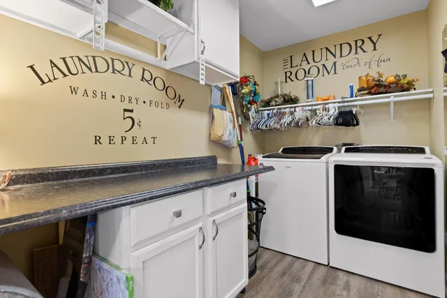 a utility room with a stove and a sign on the wall