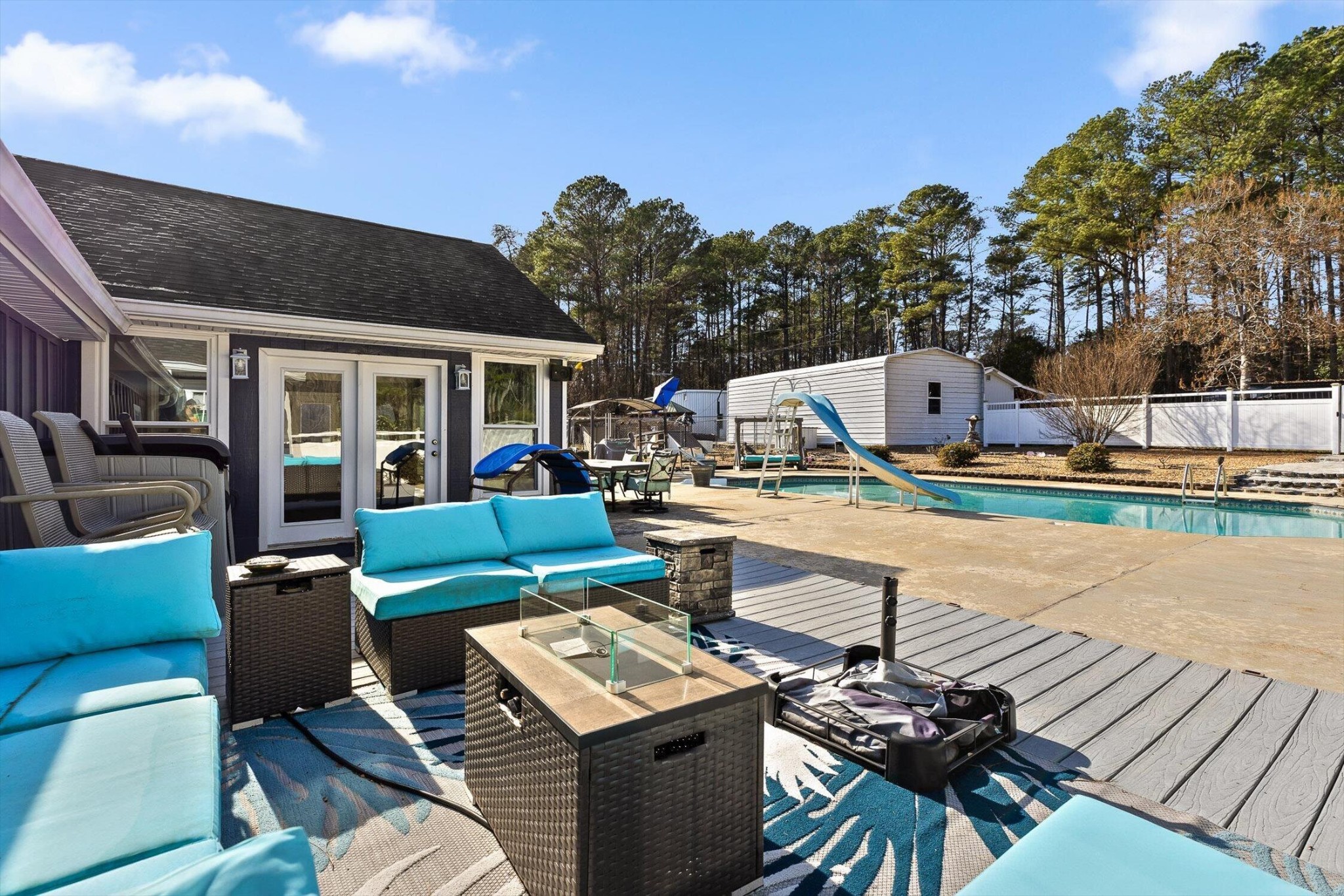 5017 McDonald Road McDonald, TN 37353 - Photo 31 of 52 a view of a patio with couches table and chairs with wooden floor and fence