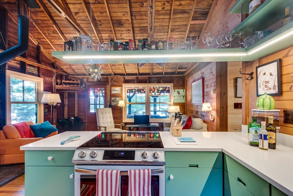 213 Ashby Road Ashburnham, MA 01430 - Photo 12 of 39 a kitchen with a stove and a cabinets