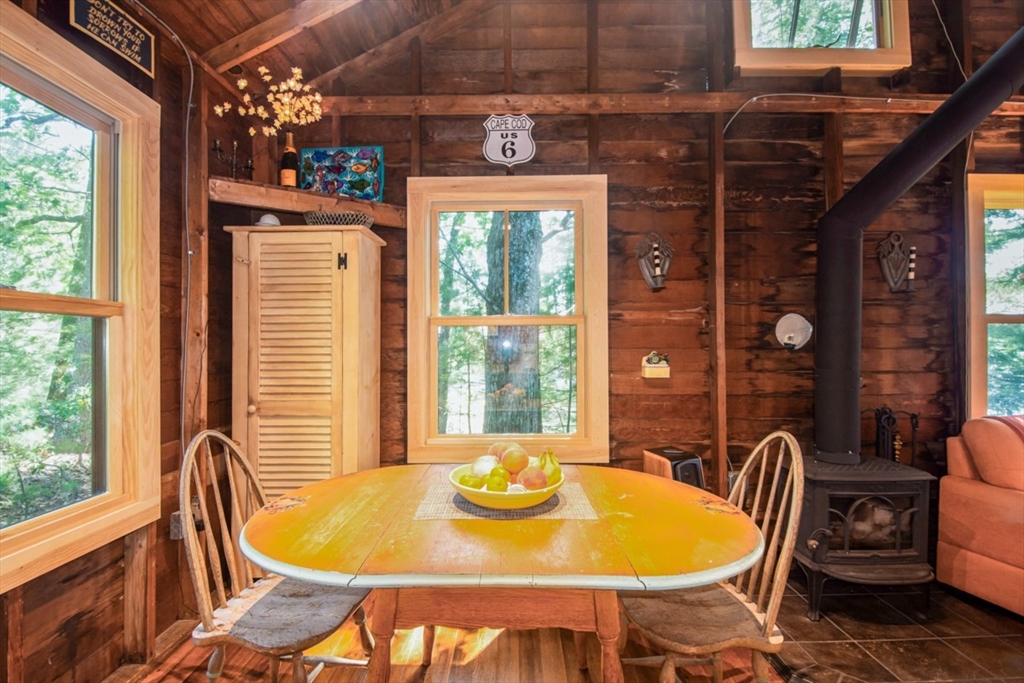 213 Ashby Road Ashburnham, MA 01430 - Photo 13 of 39 a view of a dining room with furniture window and outside view