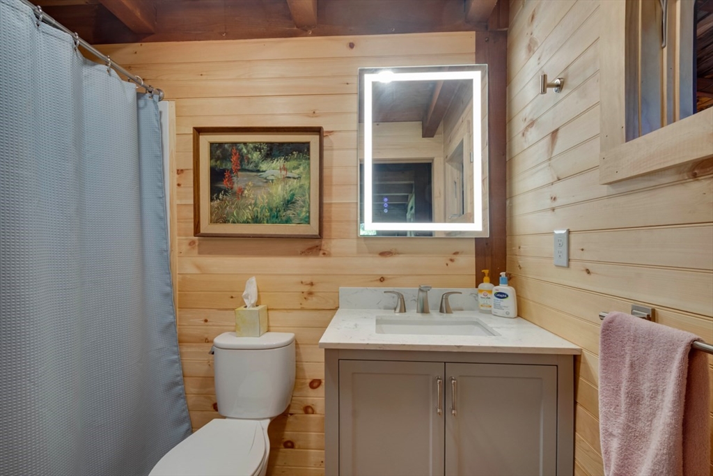 213 Ashby Road Ashburnham, MA 01430 - Photo 18 of 39 a bathroom with a toilet sink and mirror