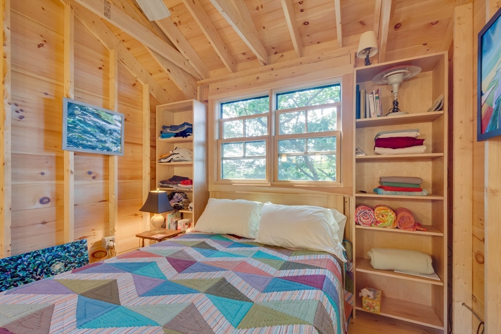 213 Ashby Road Ashburnham, MA 01430 - Photo 20 of 39 a bedroom with a bed and a painting on the wall