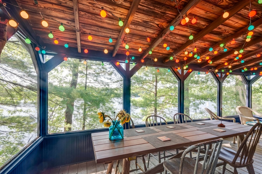 213 Ashby Road Ashburnham, MA 01430 - Photo 24 of 39 a view of a patio with furniture and wooden floor