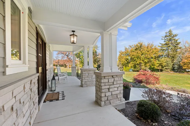 a view of living room filled with furniture and a potted plant
