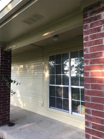 a view of a brick building with a window