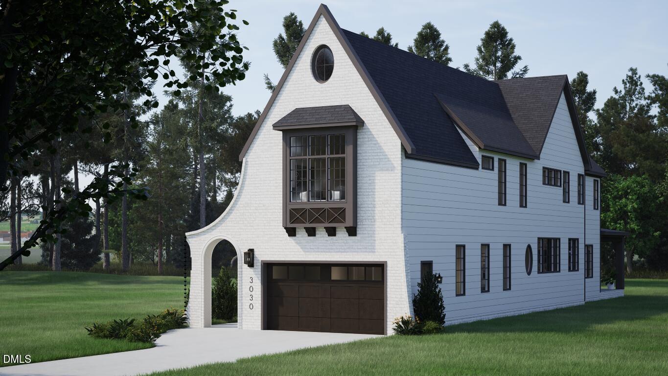 a front view of a house with a garden