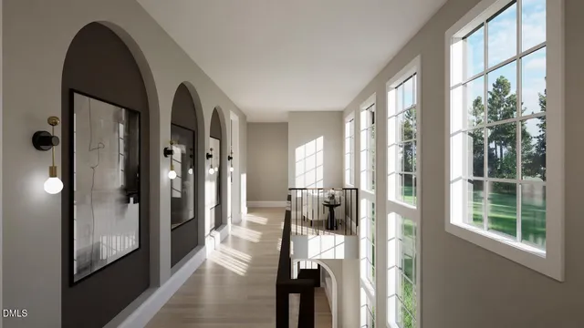a view of a hallway with a livingroom and furniture