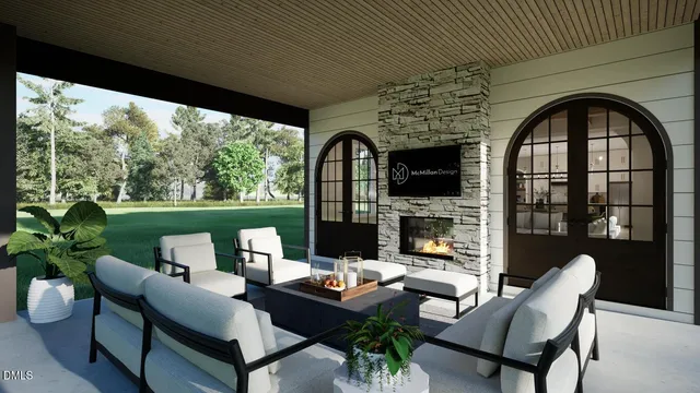 a outdoor living space with furniture potted plant and a fireplace