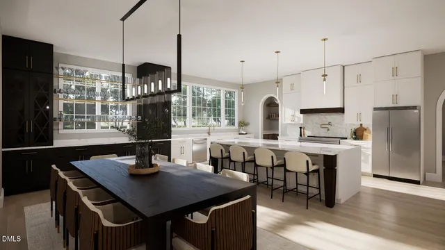 a kitchen with stainless steel appliances granite countertop a sink a stove and a refrigerator