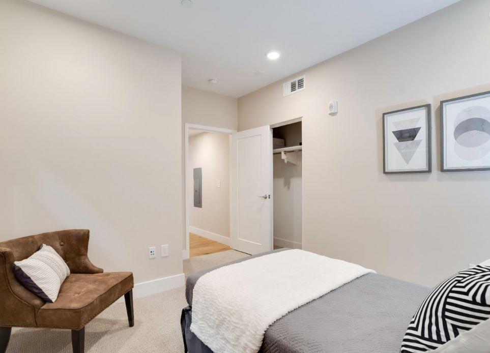 400 Mariners Island Boulevard, Unit 215 San Mateo, CA 94404 - Photo 15 of 29 a bedroom with a bed and a couch