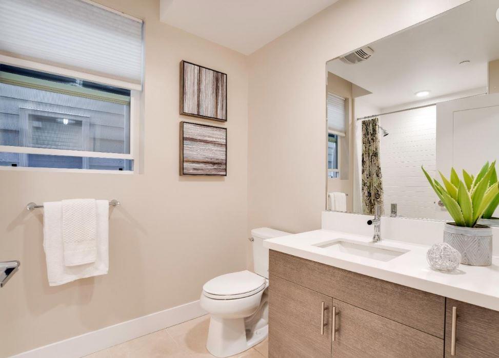 400 Mariners Island Boulevard, Unit 215 San Mateo, CA 94404 - Photo 16 of 29 a bathroom with a sink a toilet and mirror