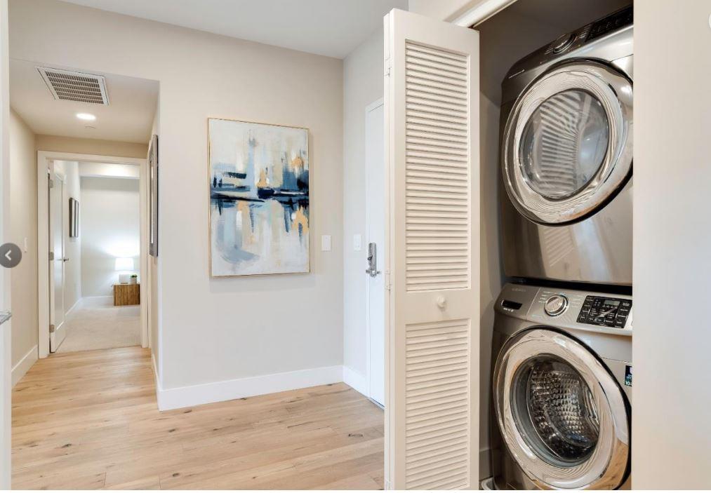 400 Mariners Island Boulevard, Unit 215 San Mateo, CA 94404 - Photo 17 of 29 a view of a hallway with washer and dryer