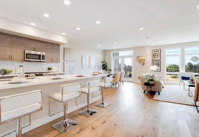 a large kitchen with lots of counter space and windows
