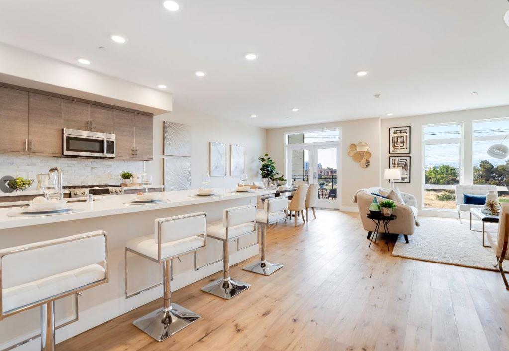 400 Mariners Island Boulevard, Unit 215 San Mateo, CA 94404 - Photo 4 of 29 a open kitchen with sink cabinets and wooden floor