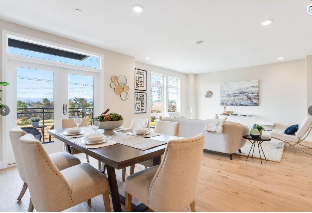 400 Mariners Island Boulevard, Unit 215 San Mateo, CA 94404 - Photo 6 of 29 a living room with furniture a large window and a table