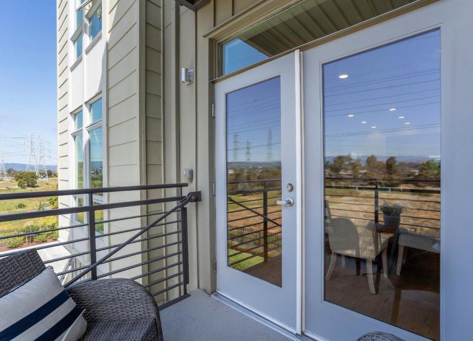400 Mariners Island Boulevard, Unit 215 San Mateo, CA 94404 - Photo 9 of 29 a view of a balcony with chairs and a table