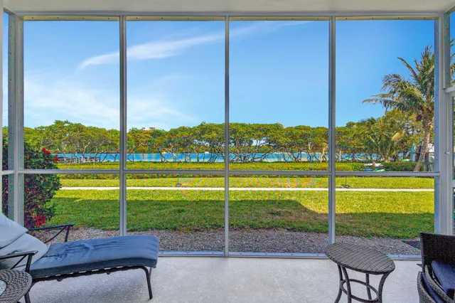 a view of a chairs and table in the garden