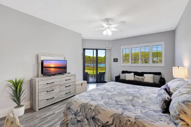 a bathroom with a granite countertop sink mirror and shower