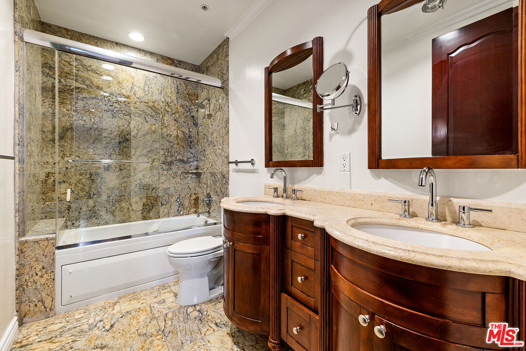 632 North Kings Road, Unit 101 West Hollywood, CA 90048 - Photo 8 of 14 a bathroom with a granite countertop sink toilet and shower