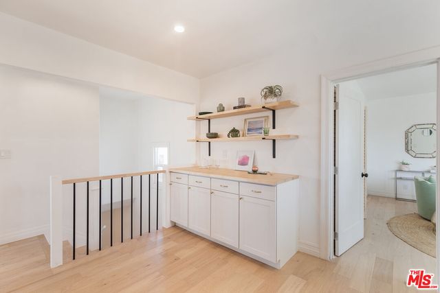 a kitchen with sink and cabinets