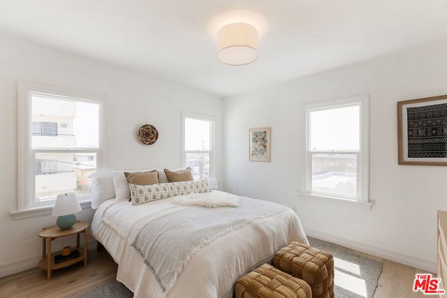 a bedroom with a bed and a couch