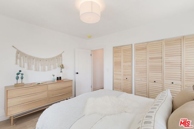 a bathroom with a bathtub a sink a window and shower