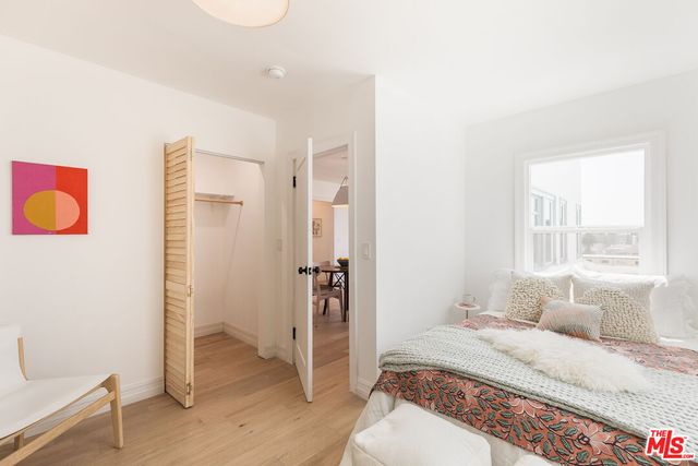 a room with a bed and a window