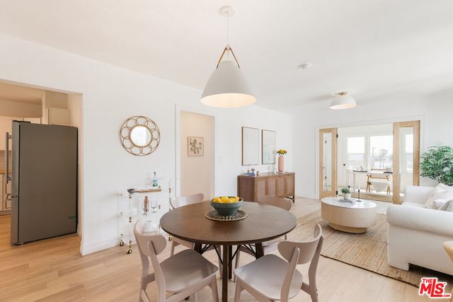 a view of a dining room with furniture and window