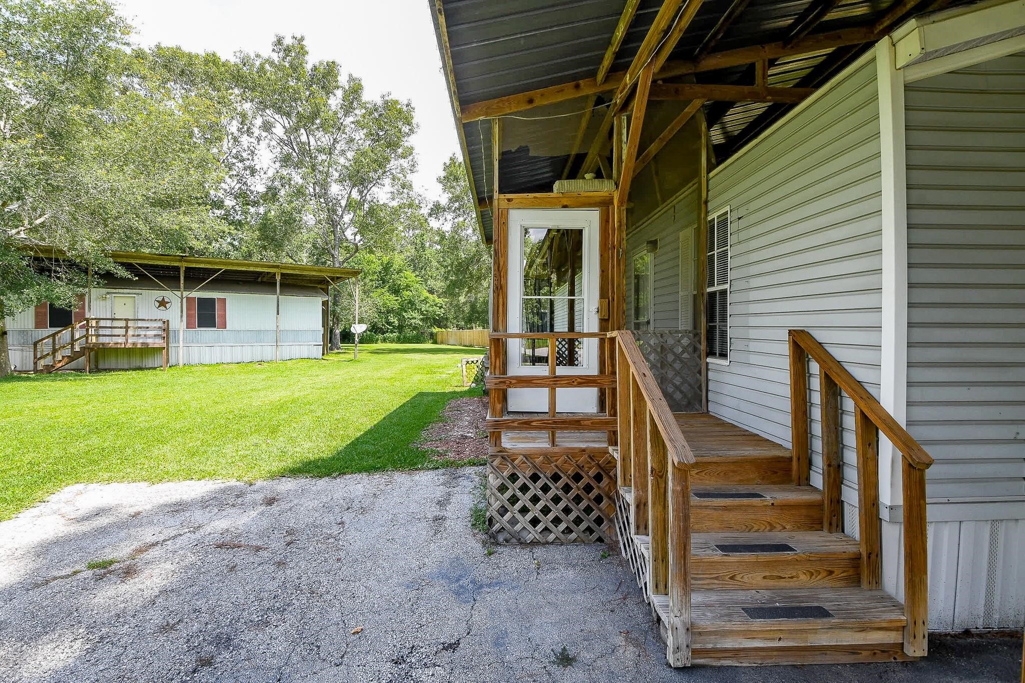 21326 Big Tree Drive Crosby, TX 77532 - Photo 13 of 19 a view of a house with backyard and porch