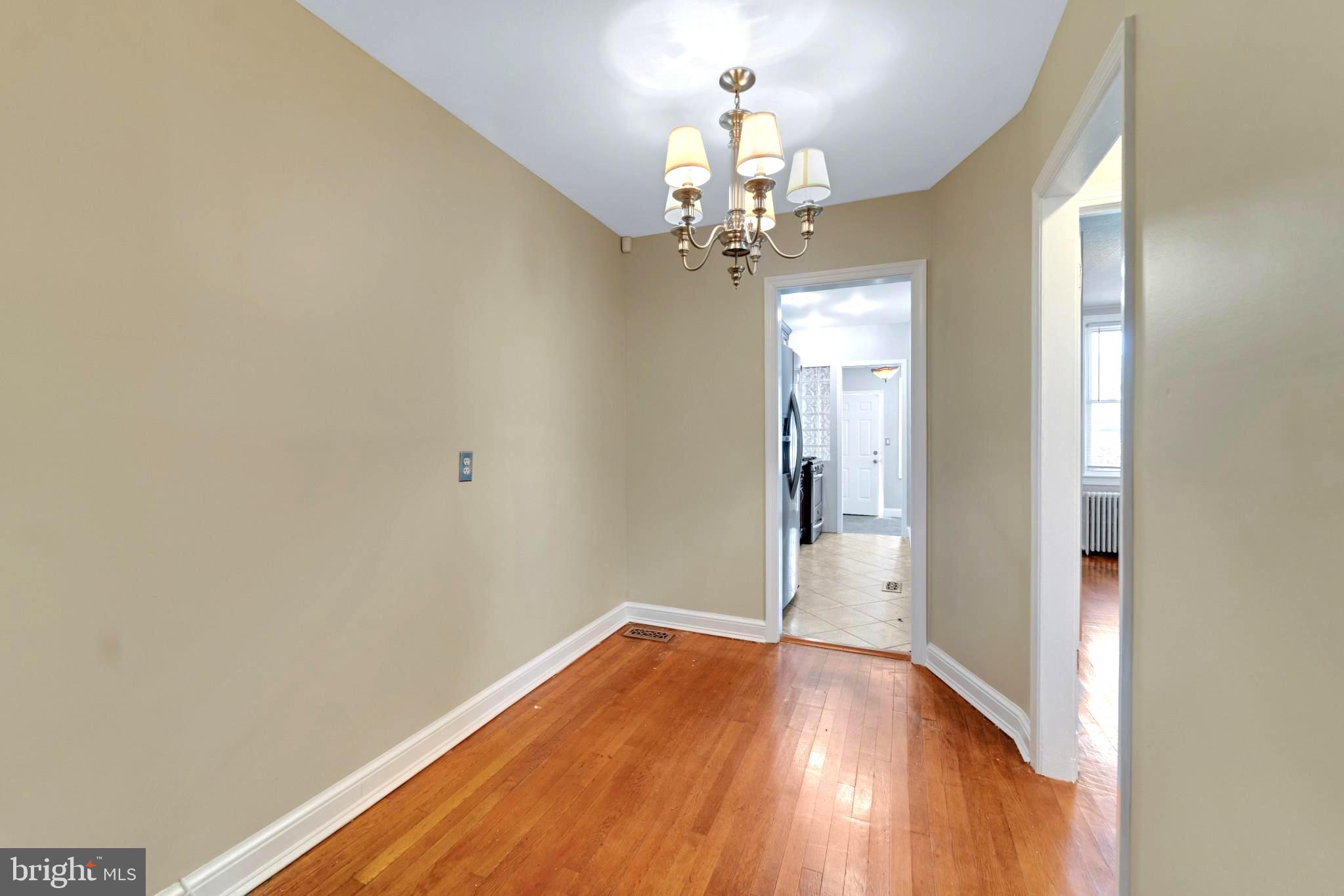 19 Hamilton Street Northeast, Unit 1 Washington, DC 20011 - Photo 5 of 17 Inviting hallway with warm wood floors.