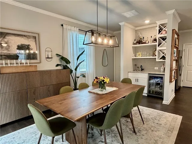 a view of a hallway with wooden floor and a window