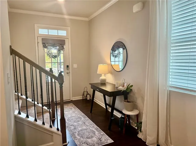a spacious bathroom with a granite countertop sink mirror and a bathtub