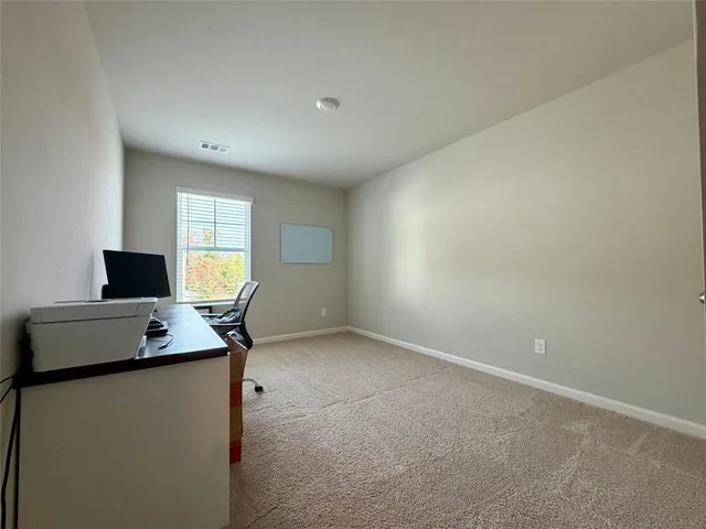 a bathroom with a double vanity sink mirror and toilet