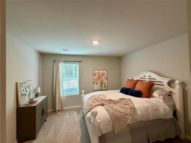 a living room with furniture and a rug