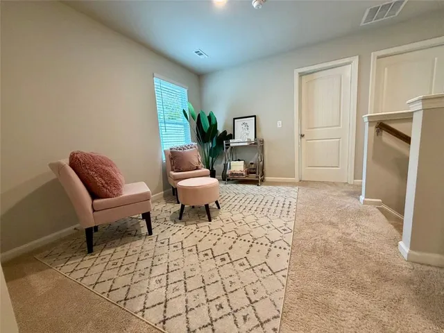 a view of a patio with table and chairs with wooden fence and plants