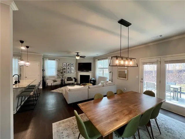 a very nice looking dining room with a table and chairs