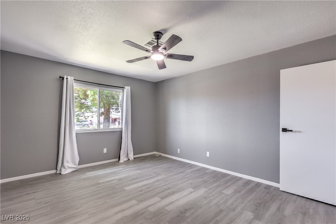 2020 Pinto Road Henderson, NV 89002 - Photo 29 of 42 Nice size primary bedroom with Luxury Vinyl Plank flooring throughout entire home