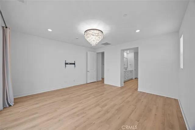 a view of an empty room with a fan