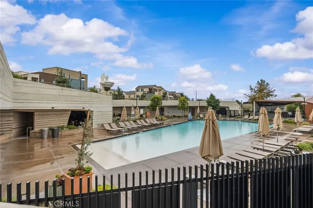 a view of a balcony with two chairs and a table