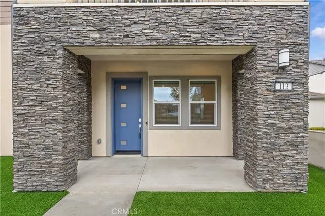 a view of front door of house with yard