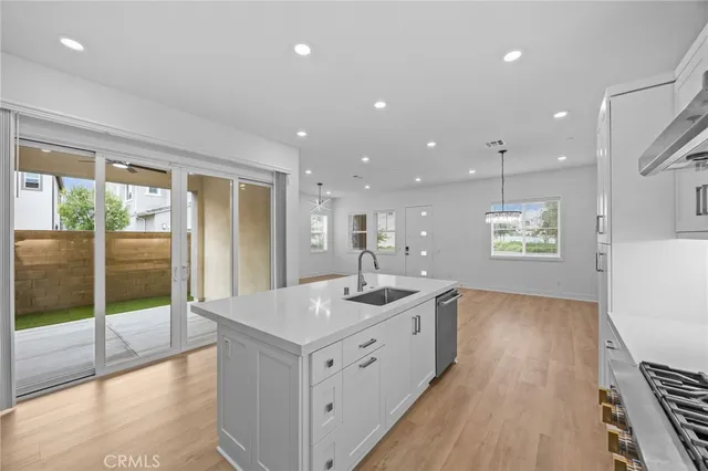 a kitchen with a sink and large window