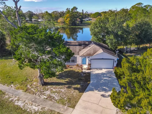 an aerial view of lake residential house with outdoor space
