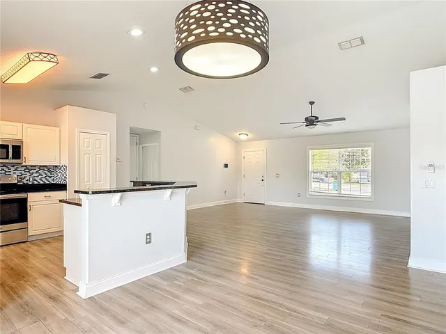 a kitchen with a stove and a microwave