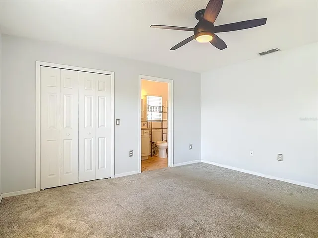 a bathroom with a sink toilet vanity and tub