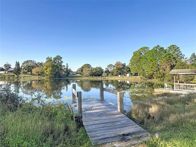 a view of a lake with a building in the background