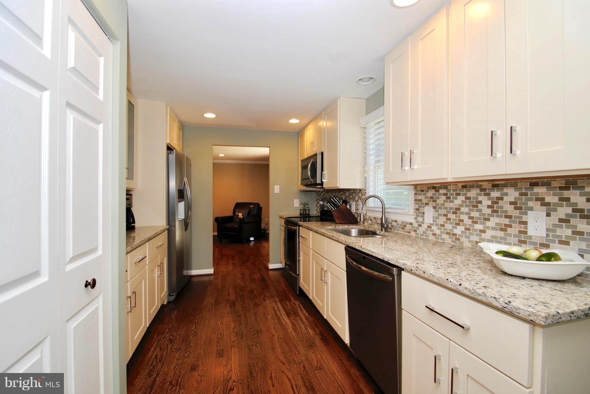 132 Church Road Arnold, MD 21012 - Photo 16 of 30 Custom Cabinetry/Pantry and Mosaic Tile Backsplash